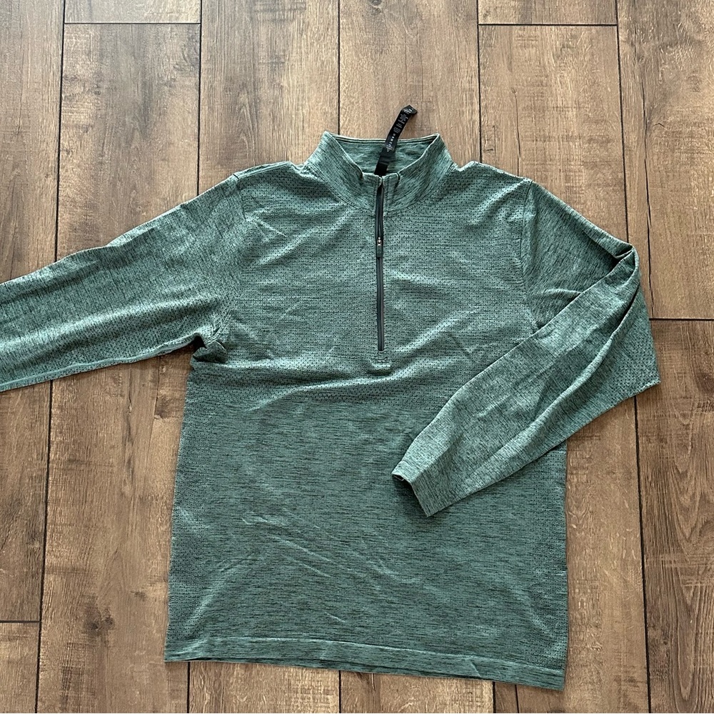 Lululemon long sleeve quarter zip in the color “spruce green”. Size Large
